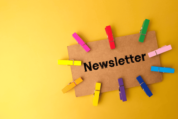 Alexander Christian provides regular Newsletters on  Insights, Industry Guidance on Anti-Money Laundering . The Image is a card with the printed word Newsletter on a yellow coloured desk.